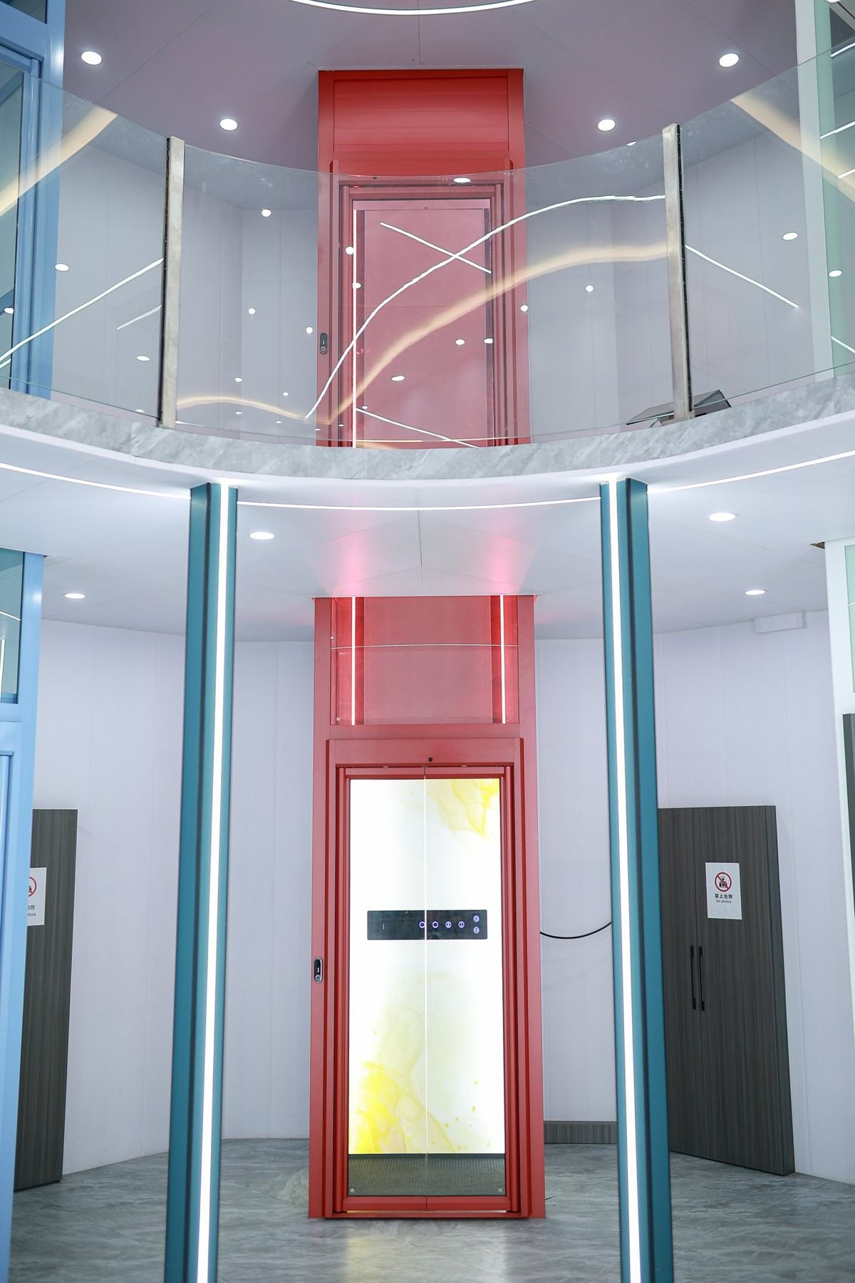 Red-framed Levitex Signature rising through an open landing.
