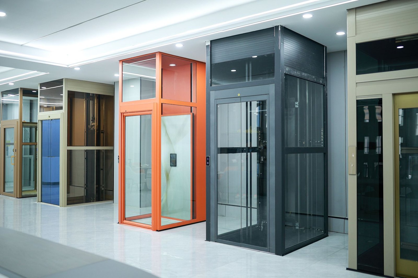 Levitex lifts in orange and black frames in the showroom.